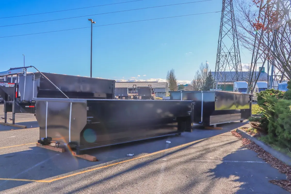 Roll-off dumpster ready for waste disposal at job site for 15 Yard Dumpster Rental in Senoia
